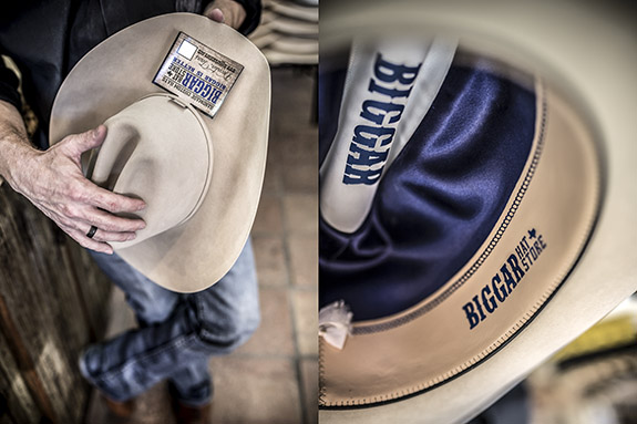 Jeff Biggar steaming and shapping a hat in his hat shop